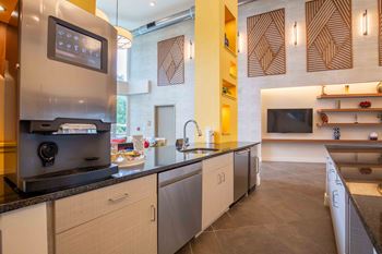 A kitchen with stainless steel appliances and a counter top